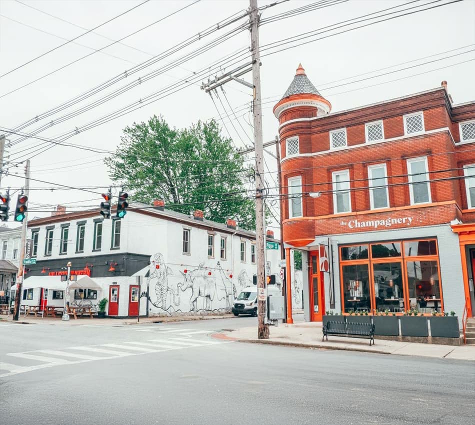 Corner of Frankfort Avenue and Pope Street, featuring the Champagnery and Hilltop Tavern.